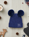 Blue knit beanie with double pom-poms