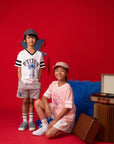 Kids wearing Stitch t-shirts on red background