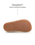 Underside of Tip Toey Joey Bossy Brave Sneakers in Tapioca and Olive Tree, showing the grippy outsole