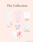 Baby product collection including a sleepsuit, onesie, hooded bath towel, ducky bath toy, and organic cotton swaddle.