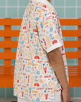Back view of the Elly Childhood Games Polo Tee showing the all-over print.