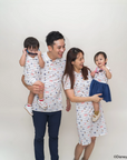 Family of four wearing matching nautical mickey outfits