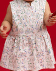 Close-up of the Elly Zodiac Mahjong print detail on the Kira Onesie fabric.