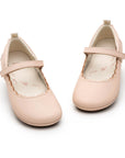 Angled view of a pair of Tip Toey Joey Misty in Papaya Cream / Metallic Salmon