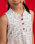 Close-up of red button details and mandarin collar on the Elly Naomi Cheongsam.