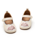 Sole and detail view of Tip Toey Joey Seashell Mary Janes in White Dream / Rose Gold / Metal Blue