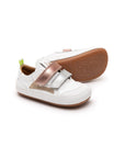 White leather baby sneakers with metallic sterling silver and rose gold accents and double velcro straps.