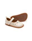 Tapioca off-white leather baby Mary Janes with heart cut-outs and a flexible rubber sole.