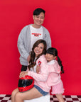 family wearing Mickey hoodies