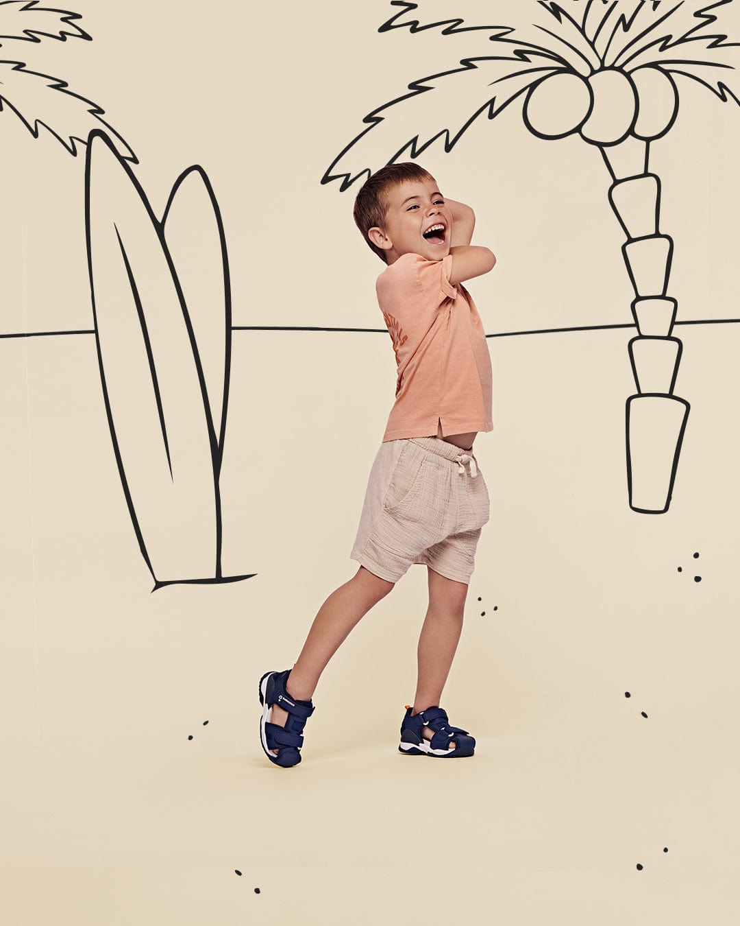 boy by a beach scene
