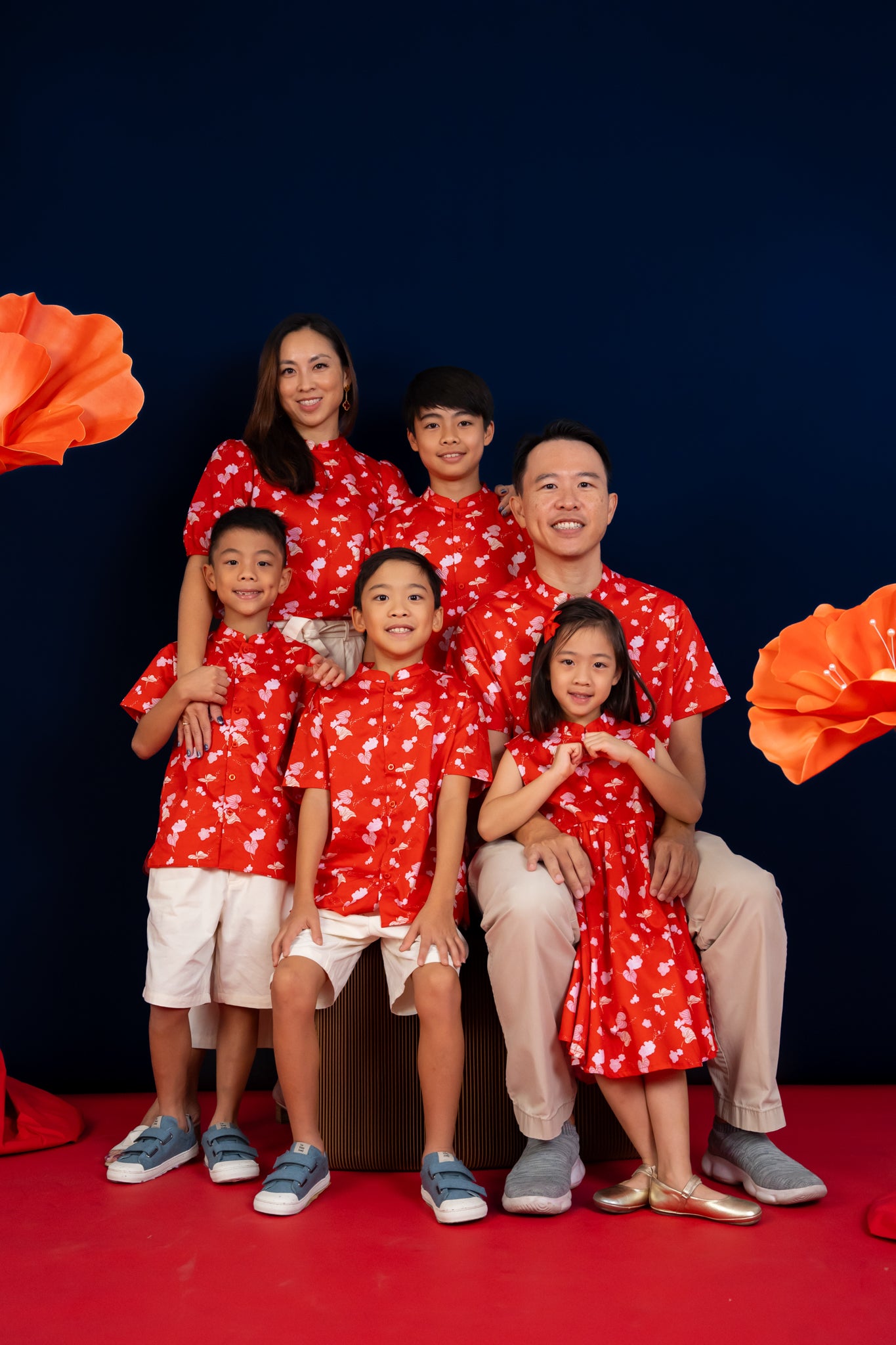 Family portrait in red floral shirts