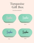 free personalisation turquoise gift box in pink, white, blue and black 