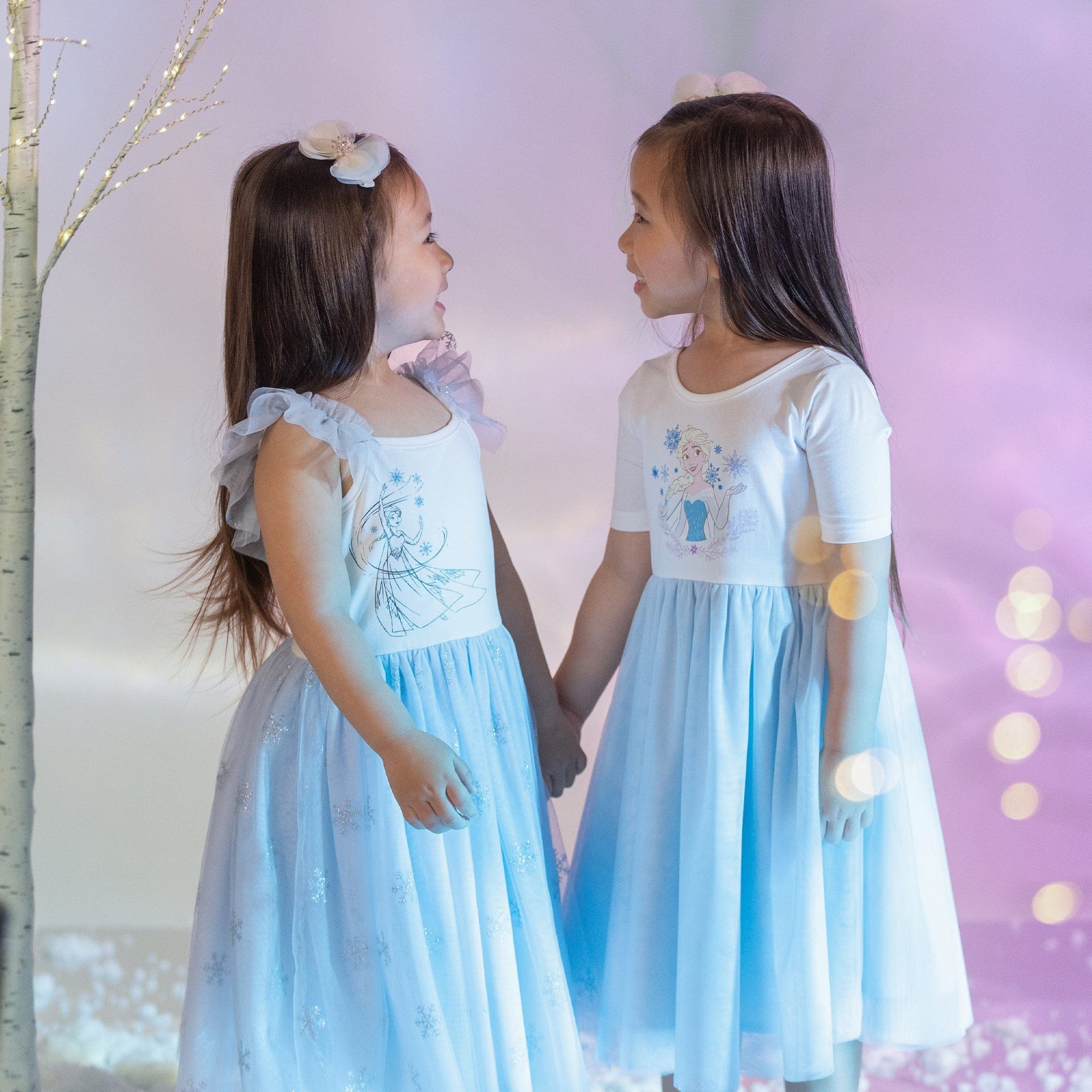 Two girls in Disney Frozen dresses