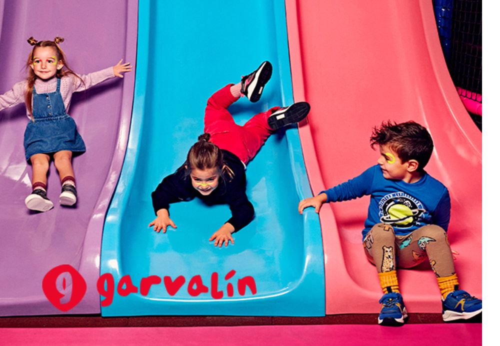Garvalin kids playing on colorful slides