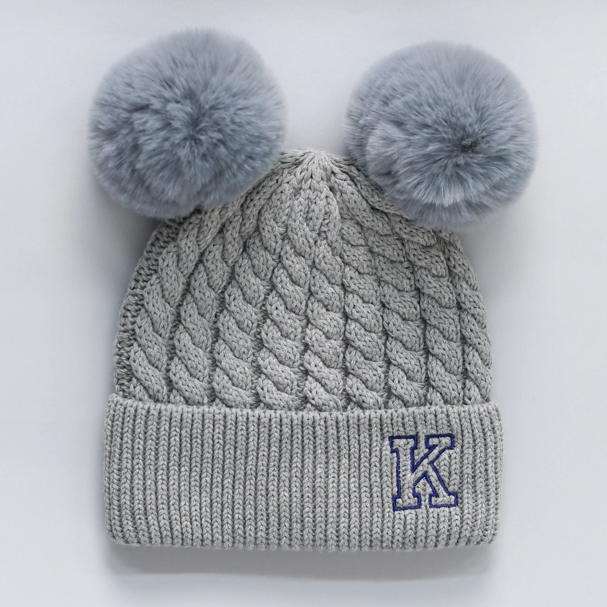 Grey knitted beanie with double pom-poms 