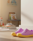 Pink shoes with yellow soles
