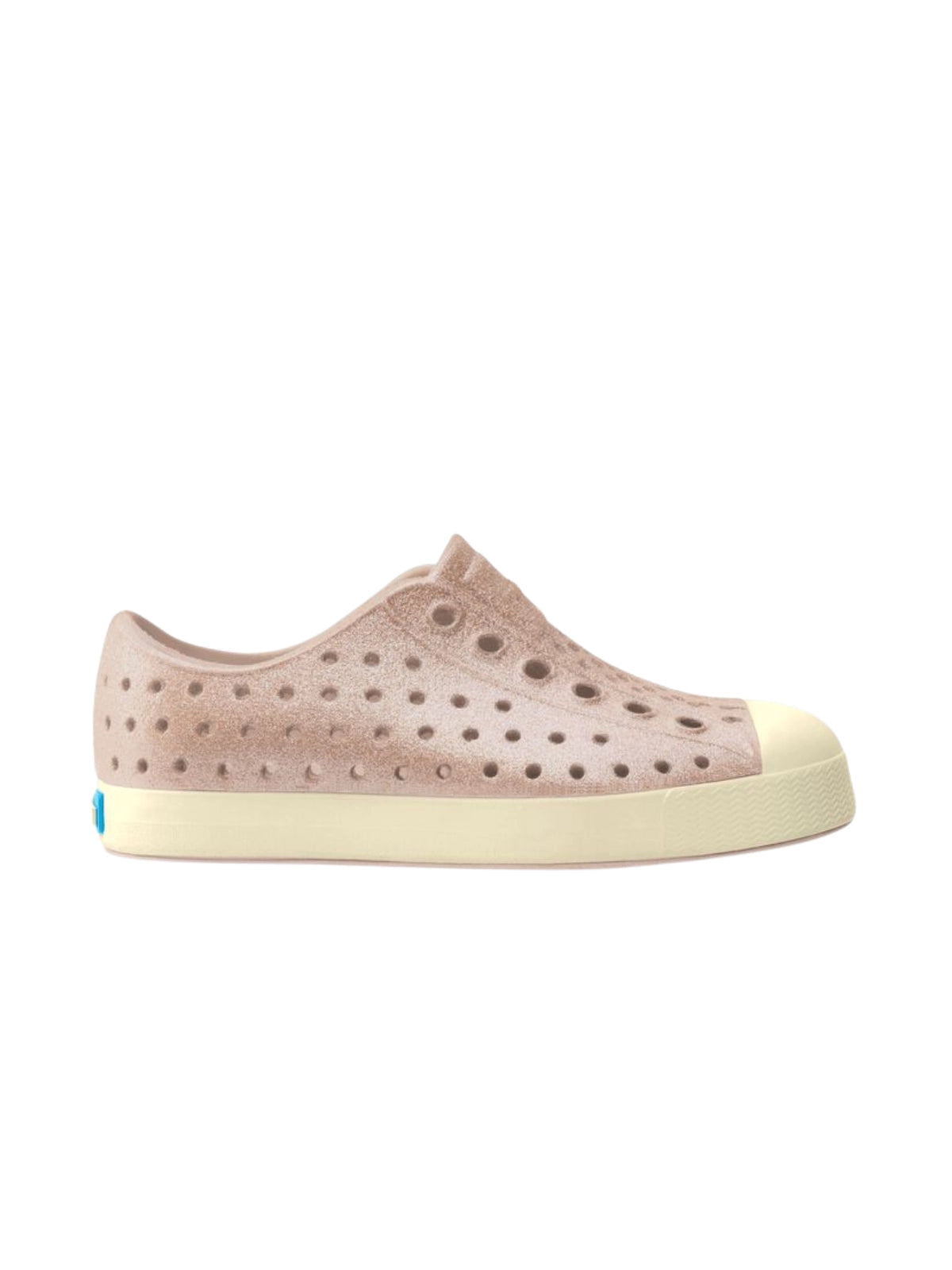 Side profile view of kids' Native Jefferson slip-on shoes in a sparkly Chameleon Pink gradient with a biodegradable plant-based glitter and a white shell sole.
