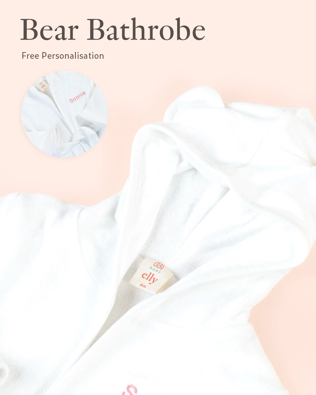 Close-up of personalised white Bear bathrobe embroidery detail on soft neutral background