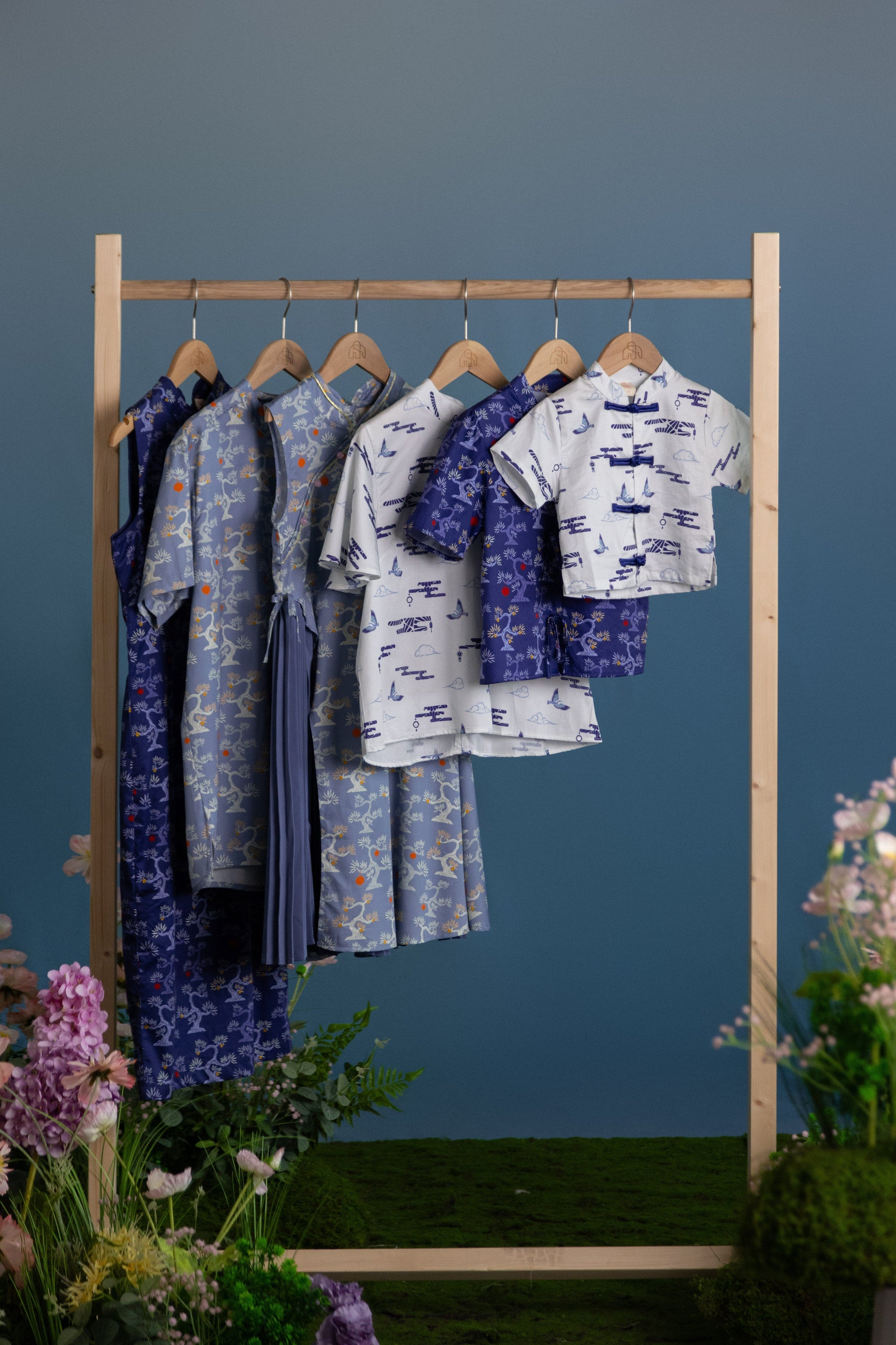 Blue patterned children's clothing on rack