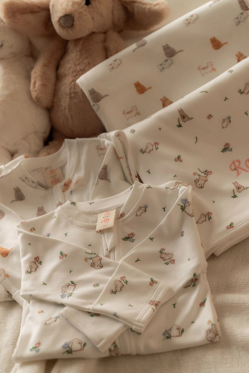 twins matching sleepsuits and blankets in sleepy cats and white floral bunny  