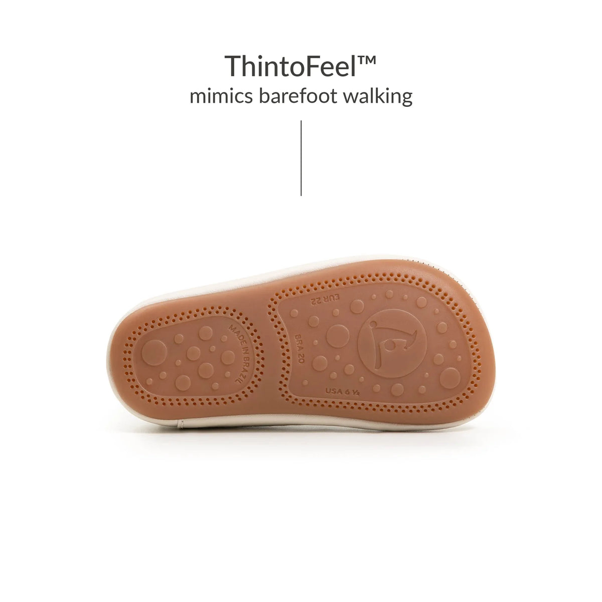 Underside of Tip Toey Joey Bossy Brave Sneakers in Tapioca and Olive Tree, showing the grippy outsole