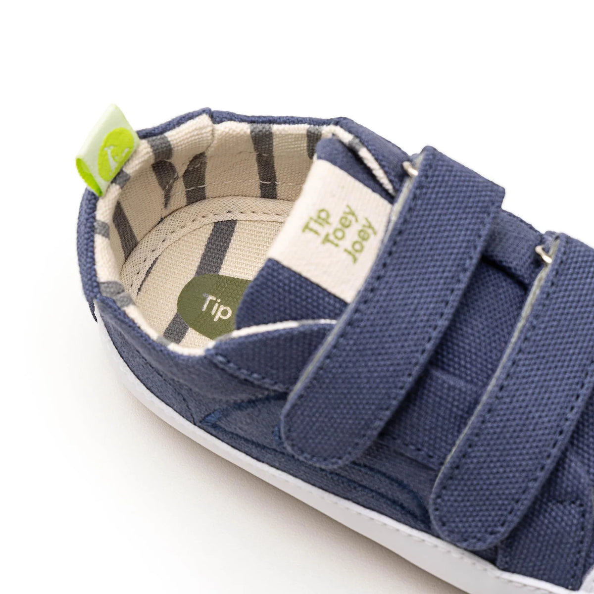 Inside of a Bossy Green Sneaker in Lona Azul Klein showing the soft lining and insole