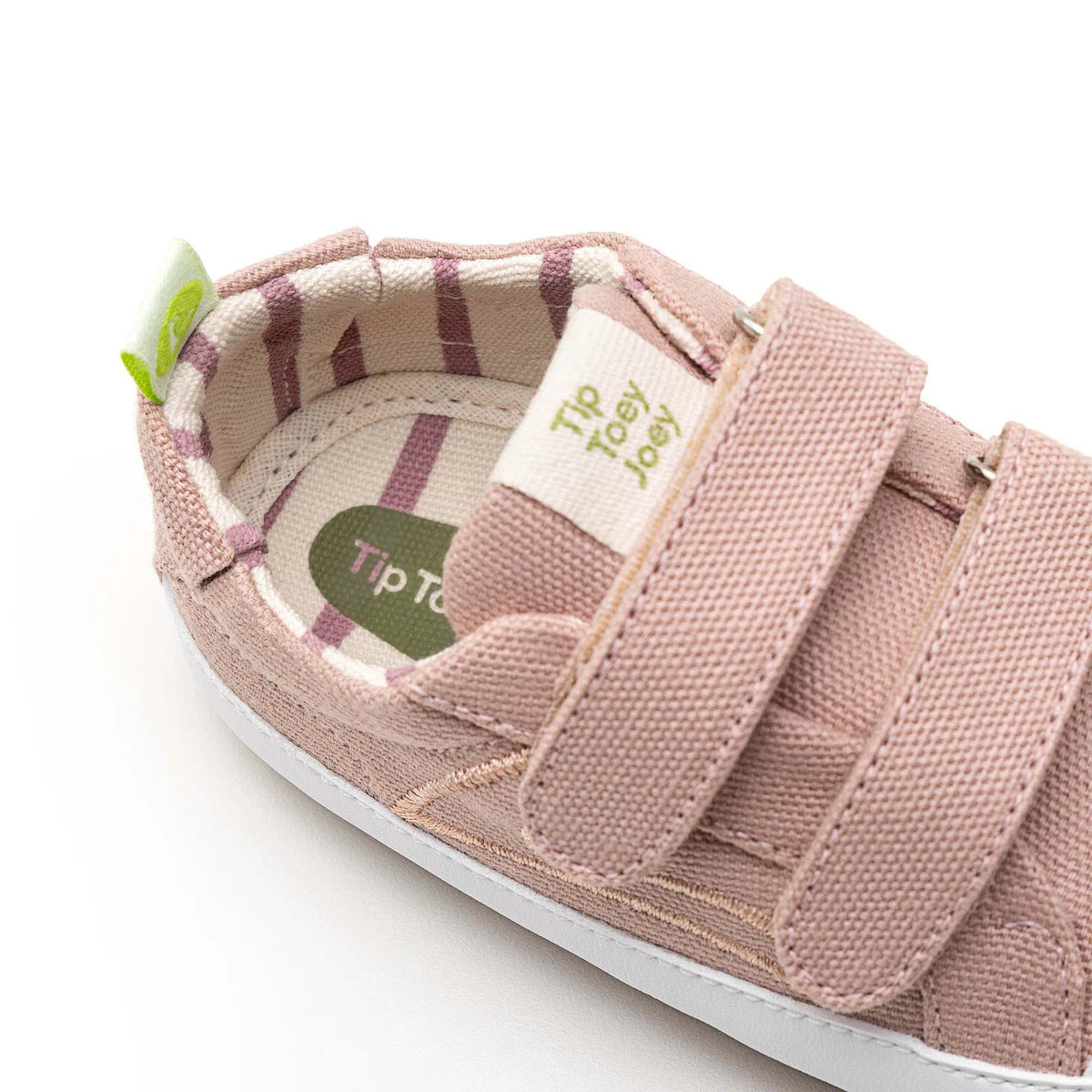 Angled view of a pair of Tip Toey Joey Bossy Green Sneakers in Lona Rosa Quartzo