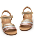 Angled view of a pair of Tip Toey Joey Coil Sandals in Metal Gold / Sterling Silver / Rose Gold