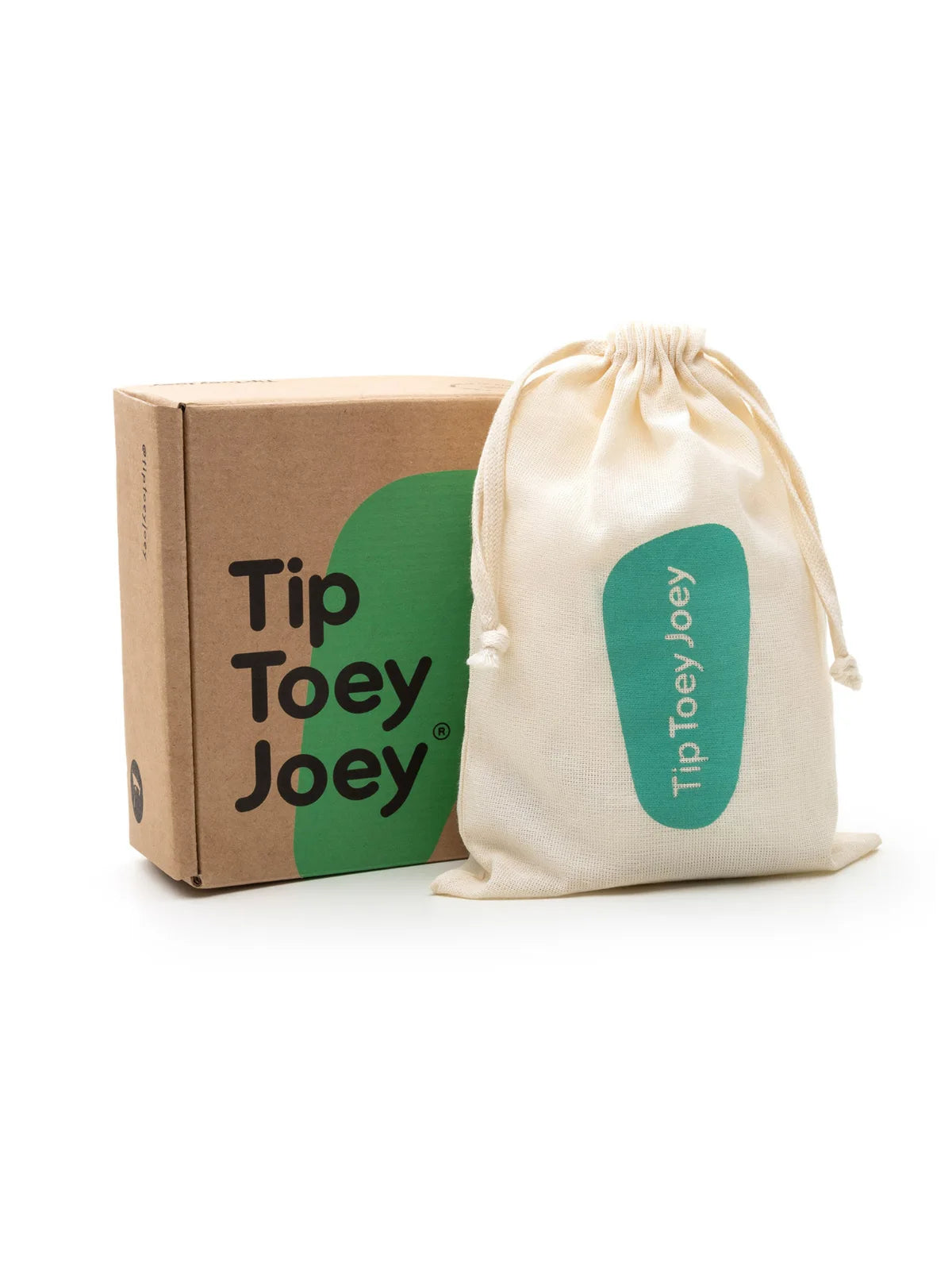 The Dolly Mary Jane baby shoes in champagne, presented with a branded Tip Toey Joey eco-friendly box and fabric drawstring keepsake bag