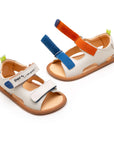Angled view of a pair of Tip Toey Joey Explore Born to Move Sandals in Tapioca