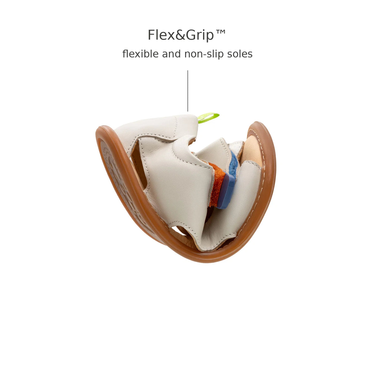 Tip Toey Joey Explore Born to Move Sandals in Tapioca bending at the toe to show the flexible sole