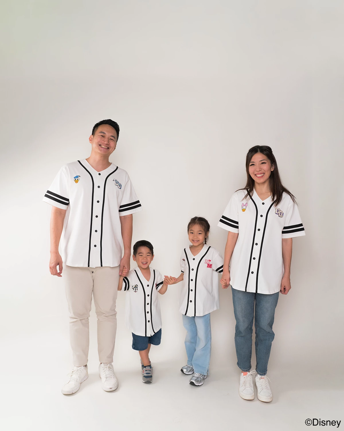 Family of four wearing matching baseball tee - pop mickey 