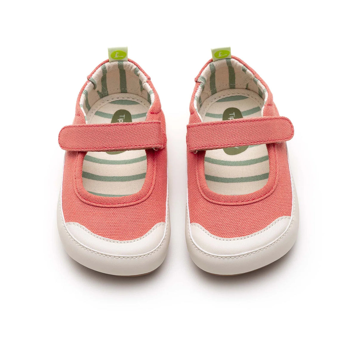 Angled view of a pair of Tip Toey Joey Gaia Green Mary Janes in Lona Salmao