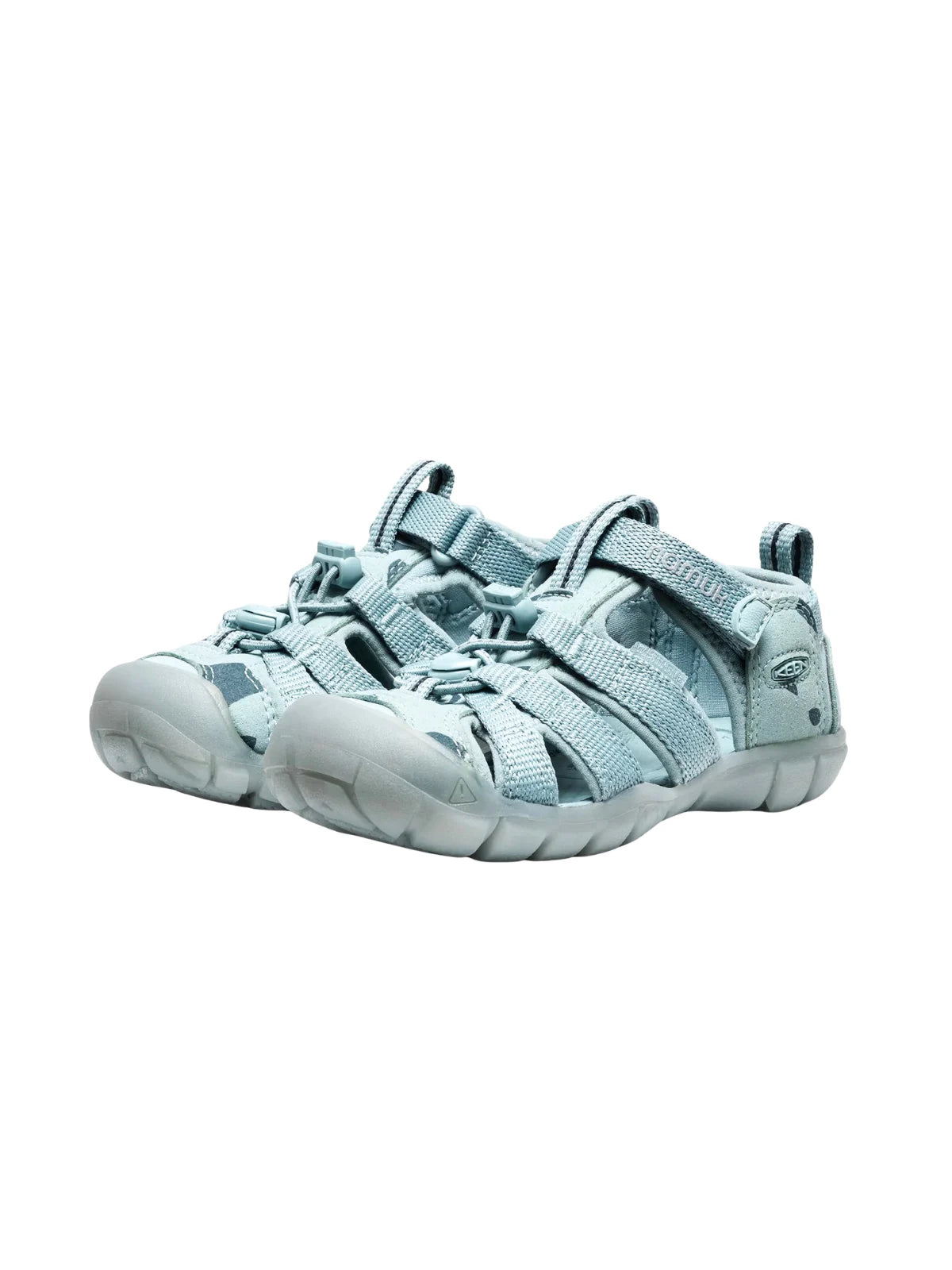A pair of children's Ice Blue adventure sandals angled toward each other, showing the uniform color and durable construction.
