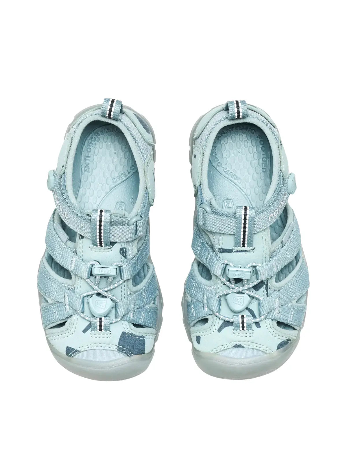 Overhead view of the Ice Blue sandals, showcasing the cushioned metatomical footbed and the wide, comfortable fit for growing feet.
