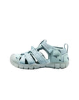 A full side-on shot of the Ice Blue KEEN sandal, emphasizing the lightweight CNX design and the adjustable hook-and-loop ankle strap.