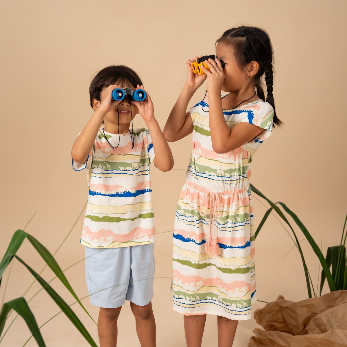 Kids using binoculars, gift essentials.