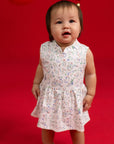 Full body view of the Kira Onesie by Elly in white Zodiac Mahjong print.