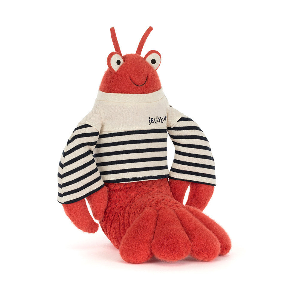 Plush toy lobster with a striped shirt on a white background