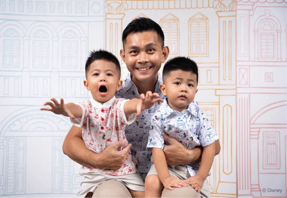 Father & sons smiling together.