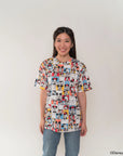 Woman wearing adult tee in pop comic mickey design with a plain background