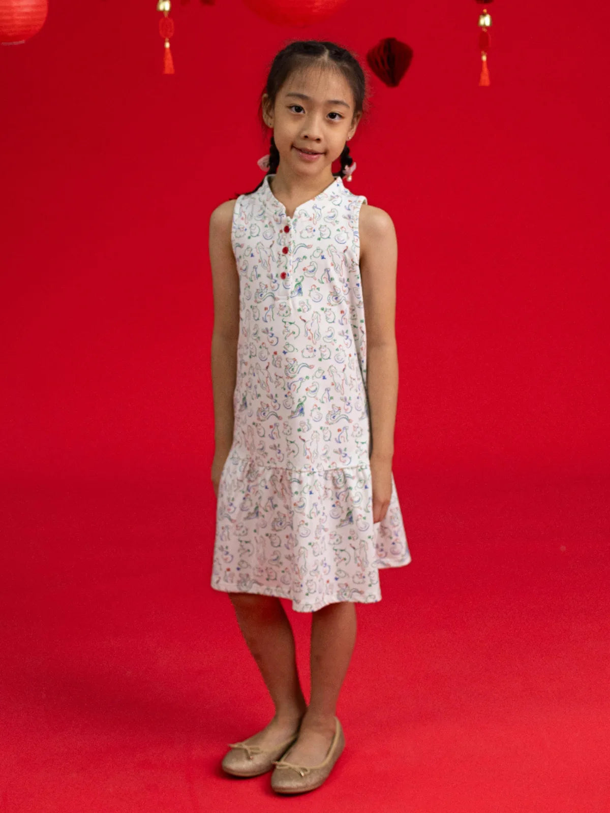 Full length view of the Naomi Cheongsam by Elly featuring an all-over Mahjong print.