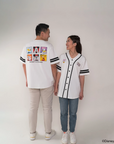 parents  wearing matching white baseball jerseys with pop mickey and friends 