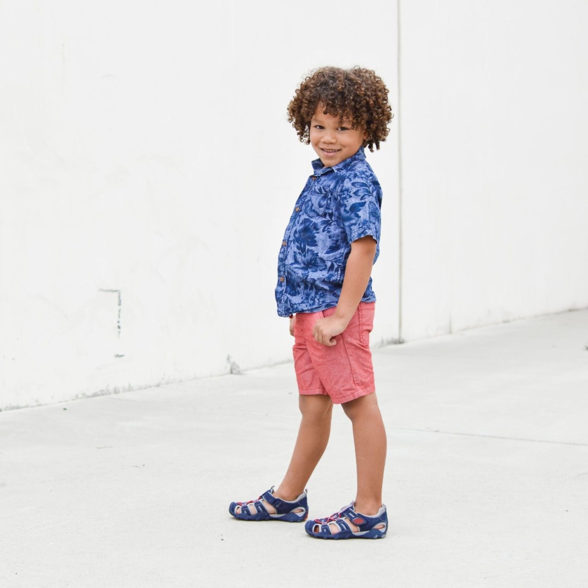 Pediped Canyon sandals on boy in blue shirt and shorts