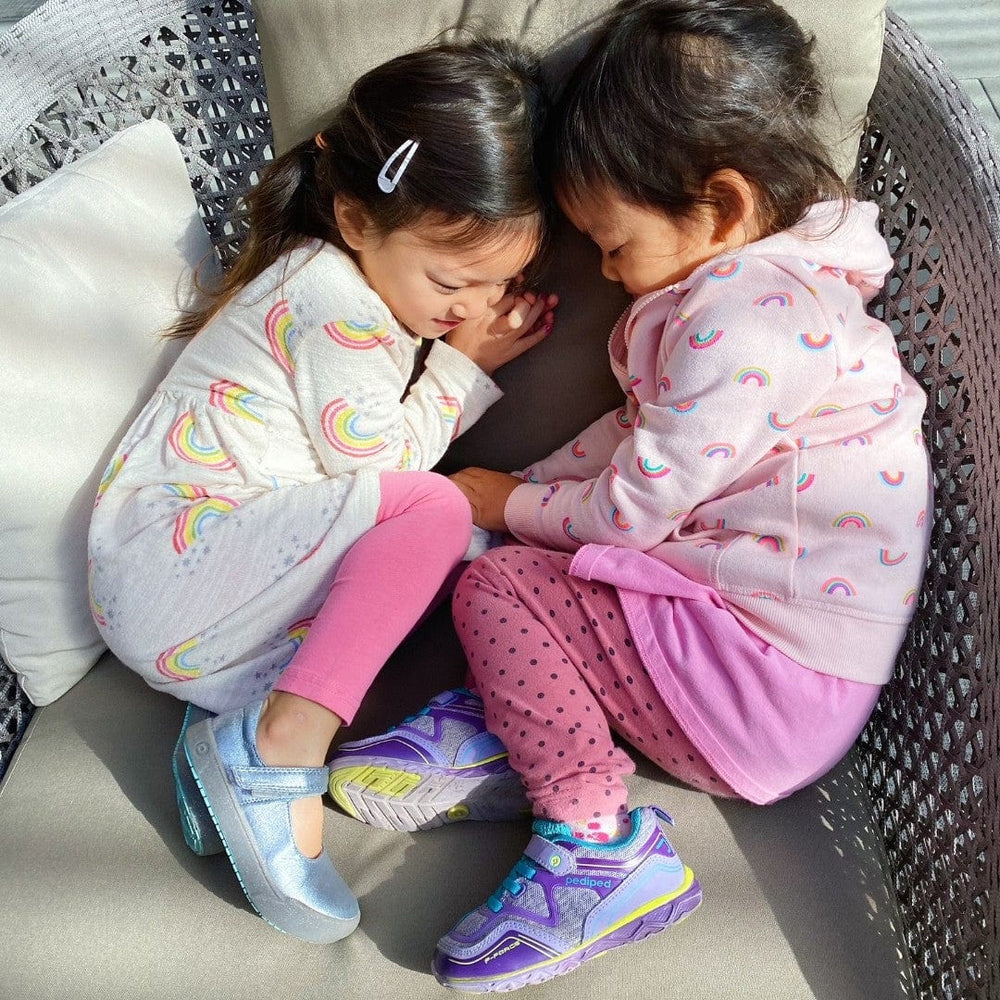Two girls resting with shoes