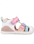 Children's sandal with colorful straps on a white background