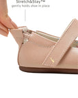 Close-up of the Stretch&Stay elasticated heel being pulled to show secure fit on a pink leather shoe.