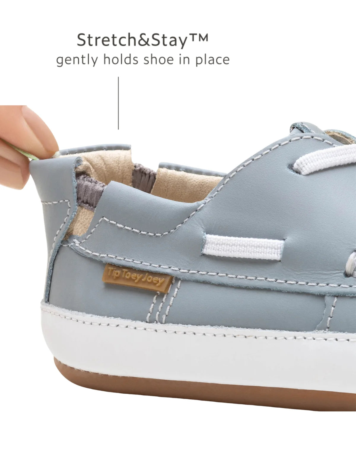 Close-up of the Stretch &amp; Stay elastic heel on the Tide Blue baby shoe for a secure and comfortable fit.