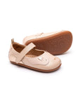 Candy dream pink leather baby Mary Janes featuring a cute kitten face design on the toe and a flexible rubber sole.