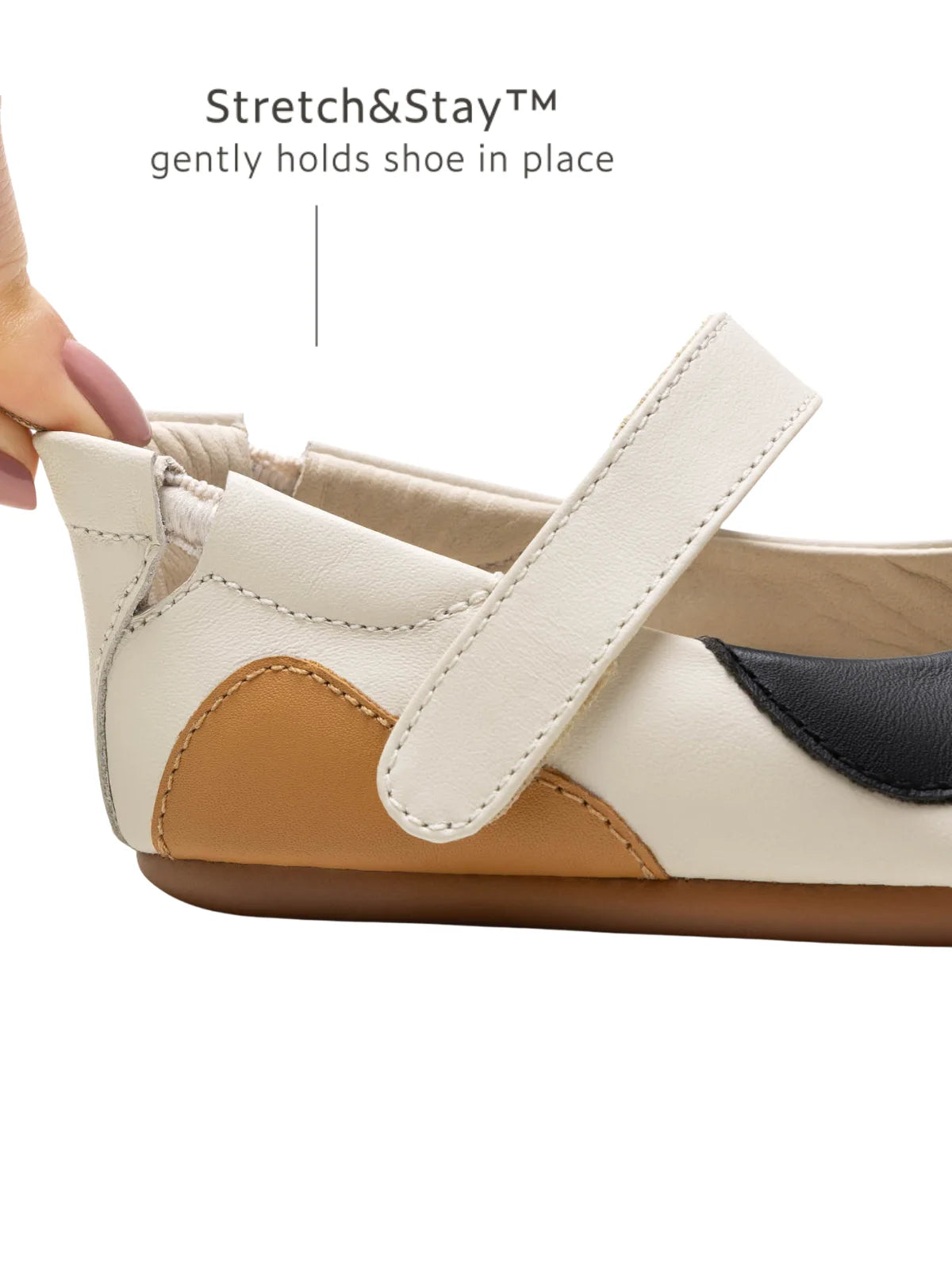 Close-up of the Stretch &amp; Stay elastic heel on the baby kitten shoe, ensuring a secure and easy fit for infants.